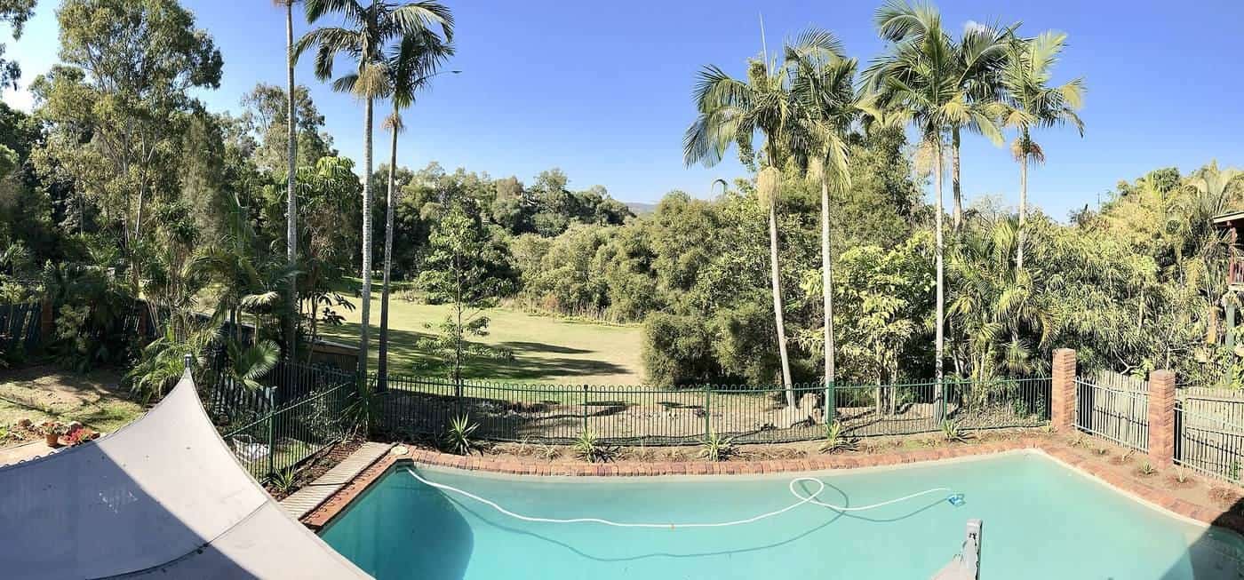 A backyard swimming pool behind a house in Corinda, Queensland