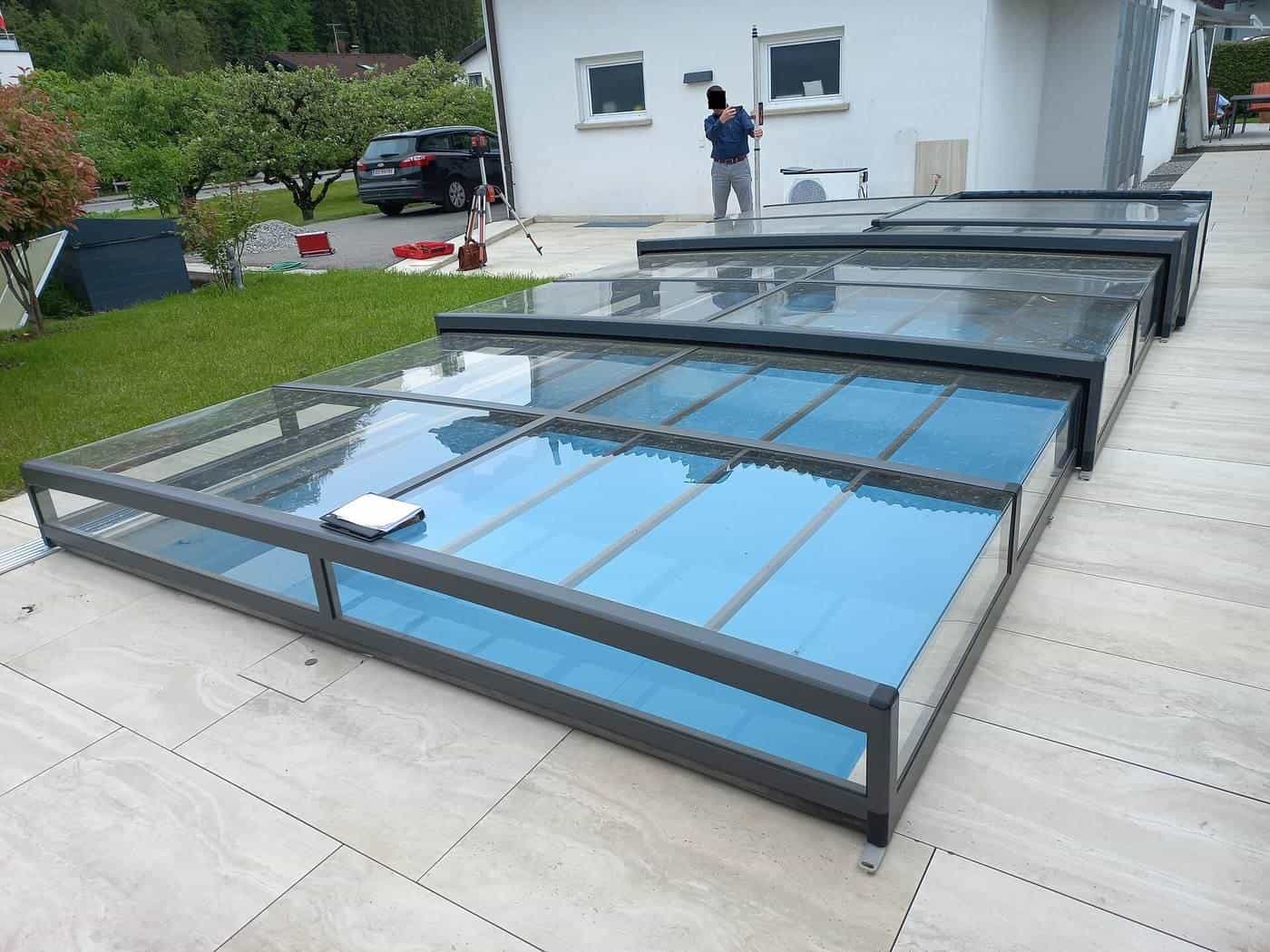 A swimming pool with a retractable cover structure